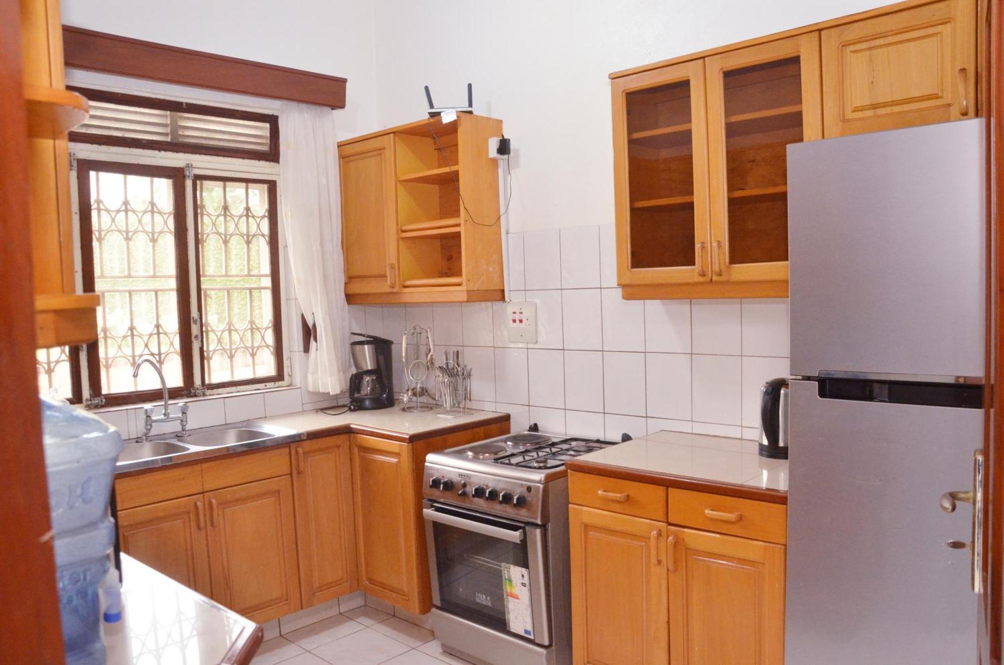 Corinya Serviced Apartments เอนเทบเบ้ ห้อง รูปภาพ
